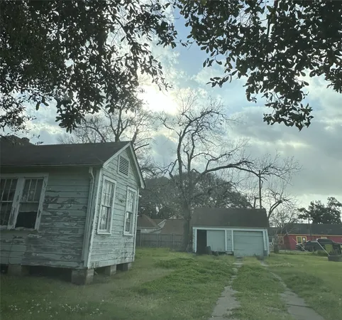 a backyard of a house with lots of green space