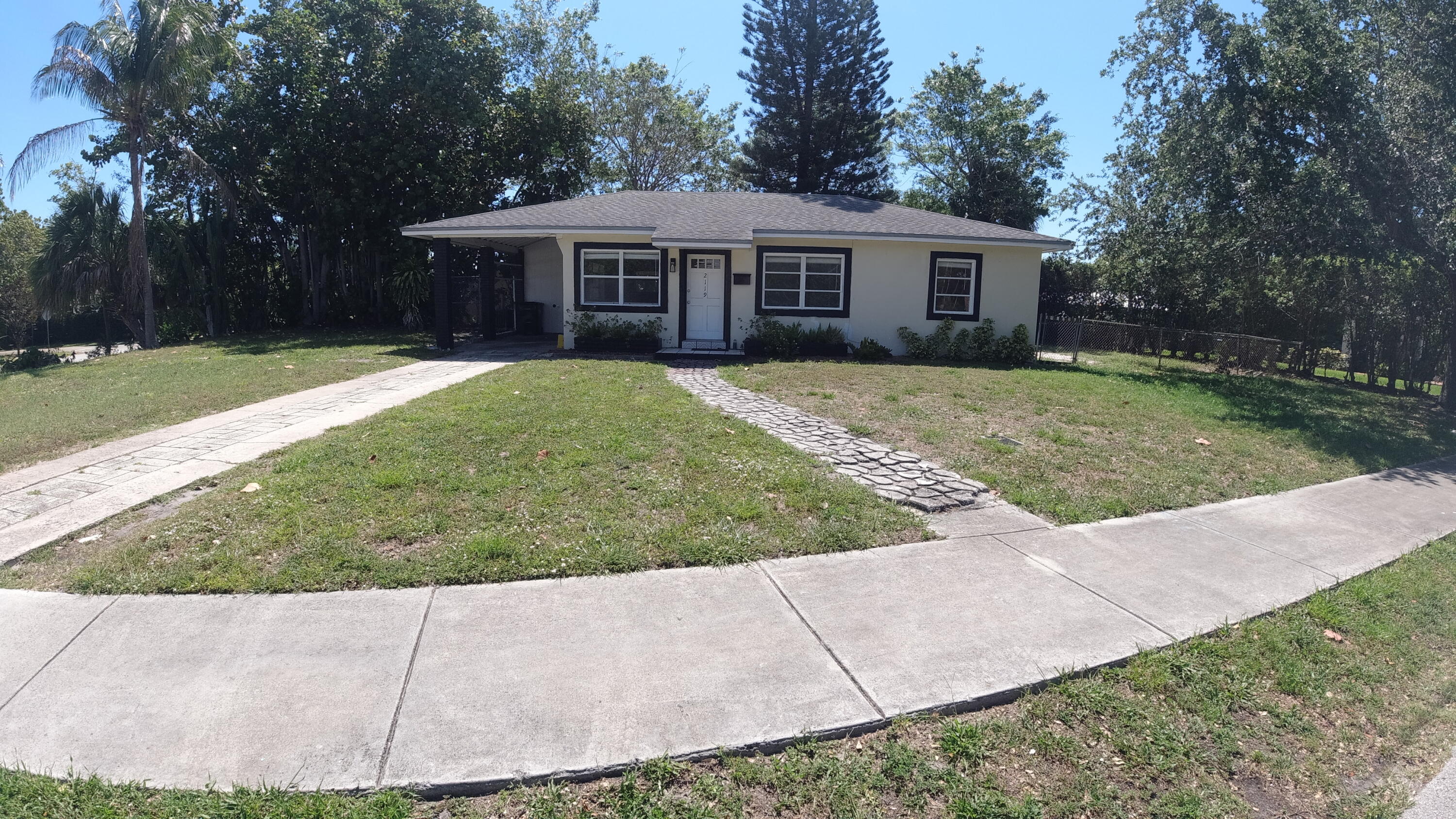 2119 Northridge Road Delray Beach, FL 33444 - Photo 2 of 12 front view of a house with a yard