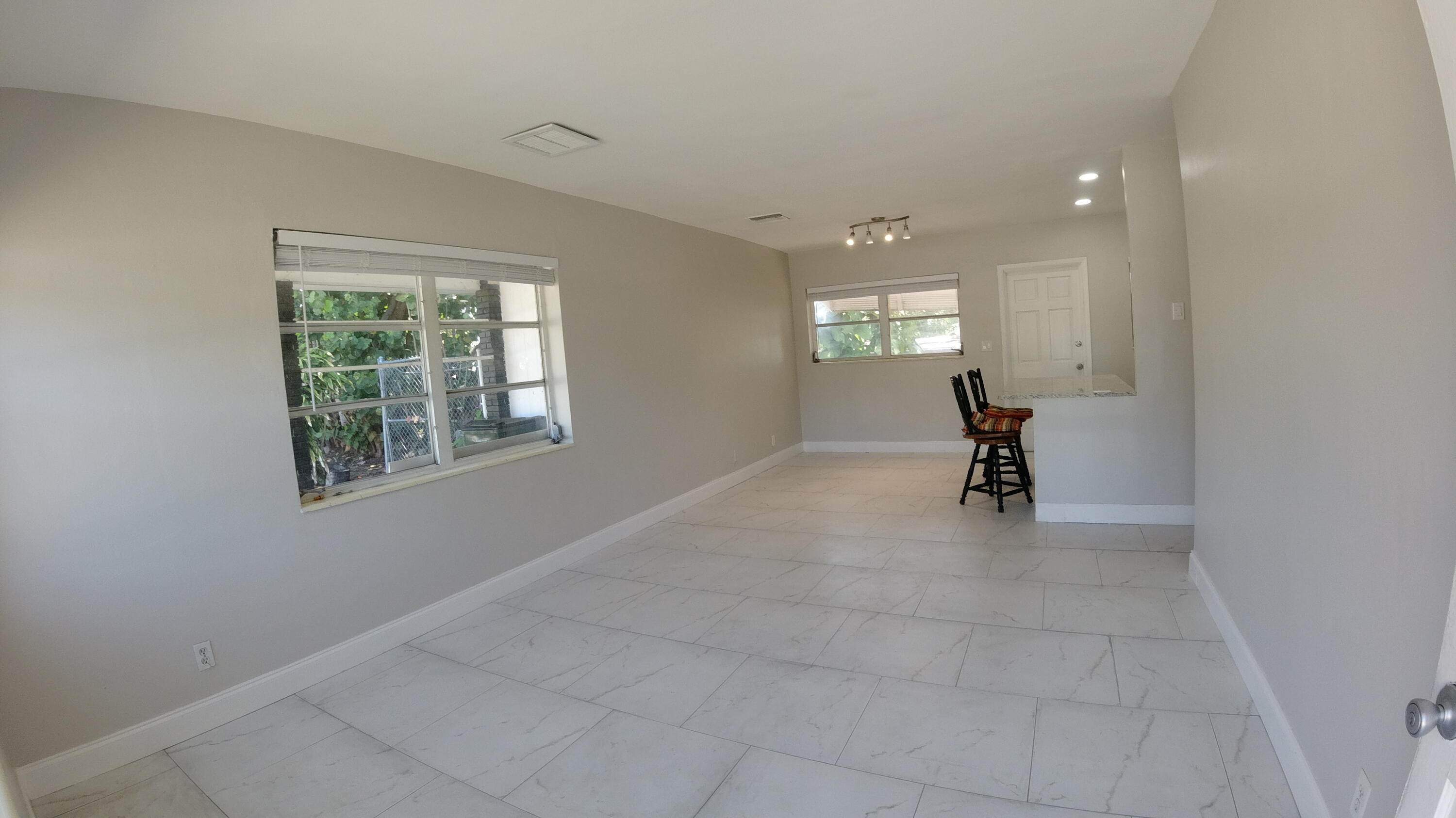 2119 Northridge Road Delray Beach, FL 33444 - Photo 5 of 12 an empty room with windows and closet