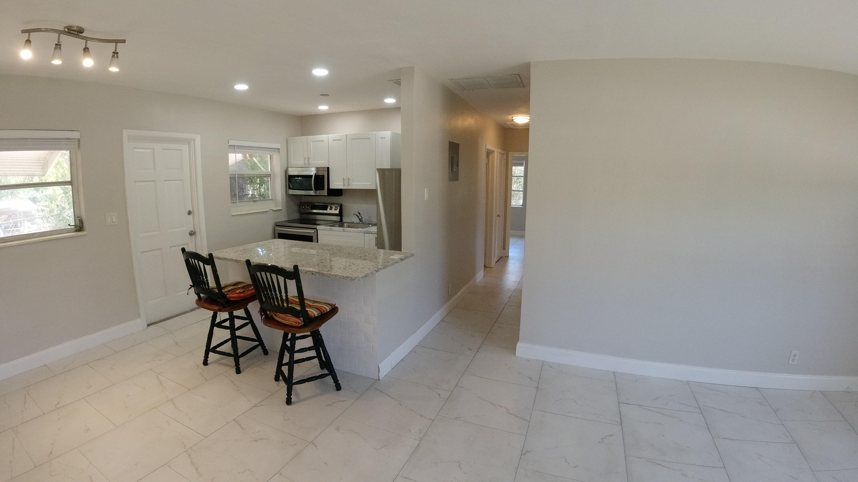 2119 Northridge Road Delray Beach, FL 33444 - Photo 7 of 12 a view of a dining room with furniture