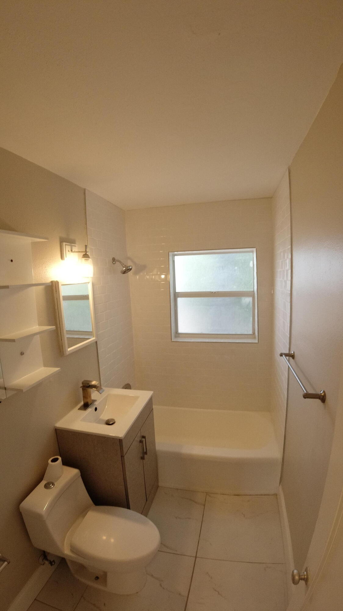 2119 Northridge Road Delray Beach, FL 33444 - Photo 9 of 12 a bathroom with a bathtub and shower