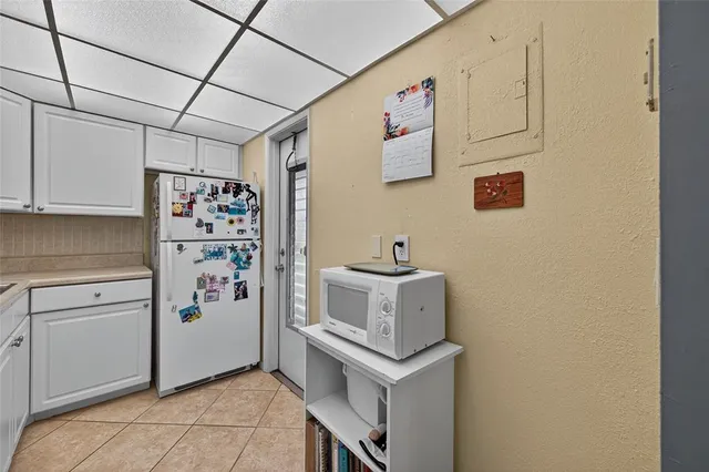a kitchen that has a sink a stove and a table in it