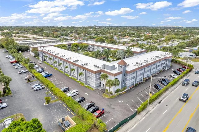 a view of a with a lot of cars and parked cars