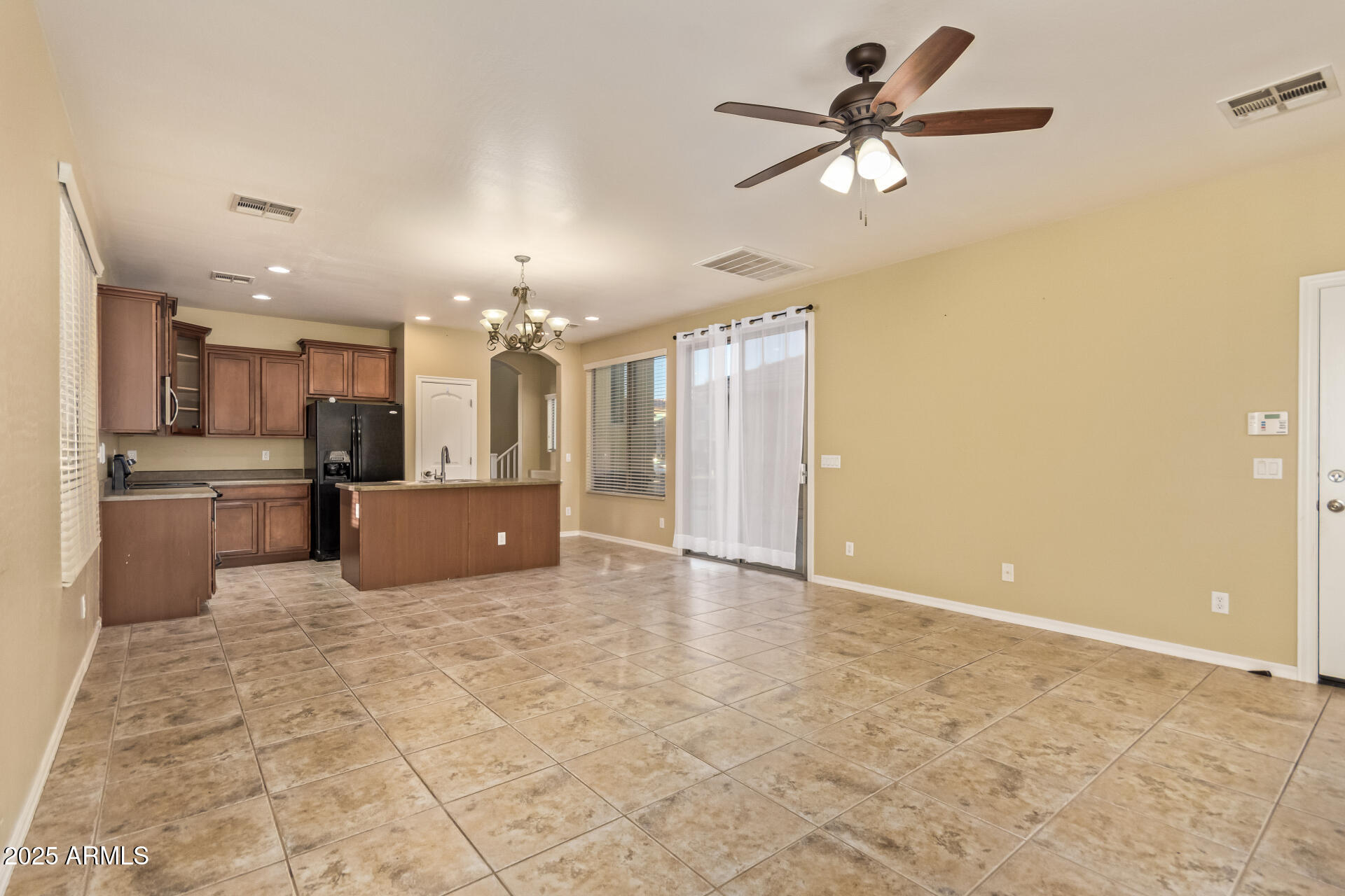 15170 North 145th Lane Surprise, AZ 85379 - Photo 17 of 40 a view of a kitchen with a sink and a refrigerator