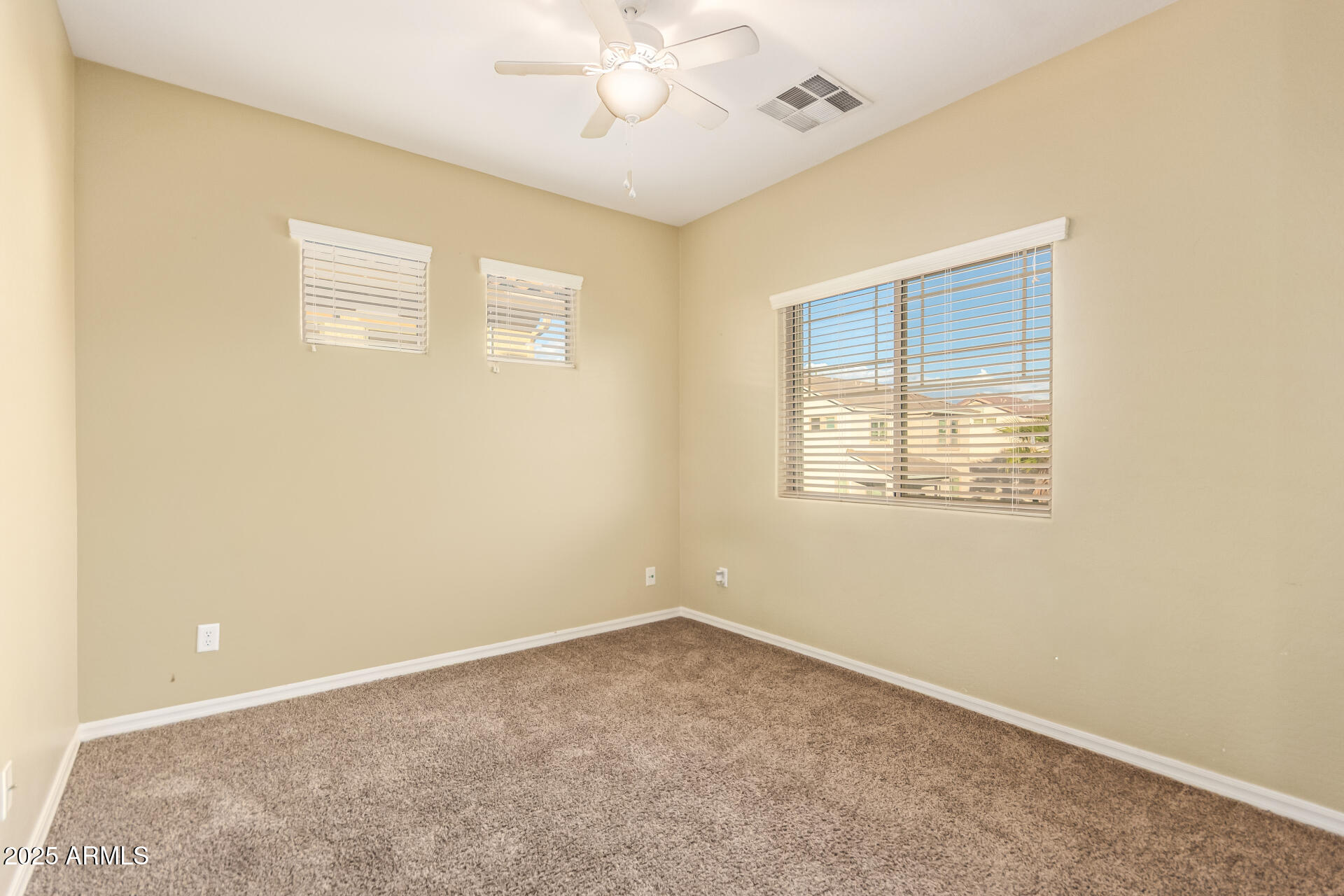 15170 North 145th Lane Surprise, AZ 85379 - Photo 19 of 40 an empty room with a window