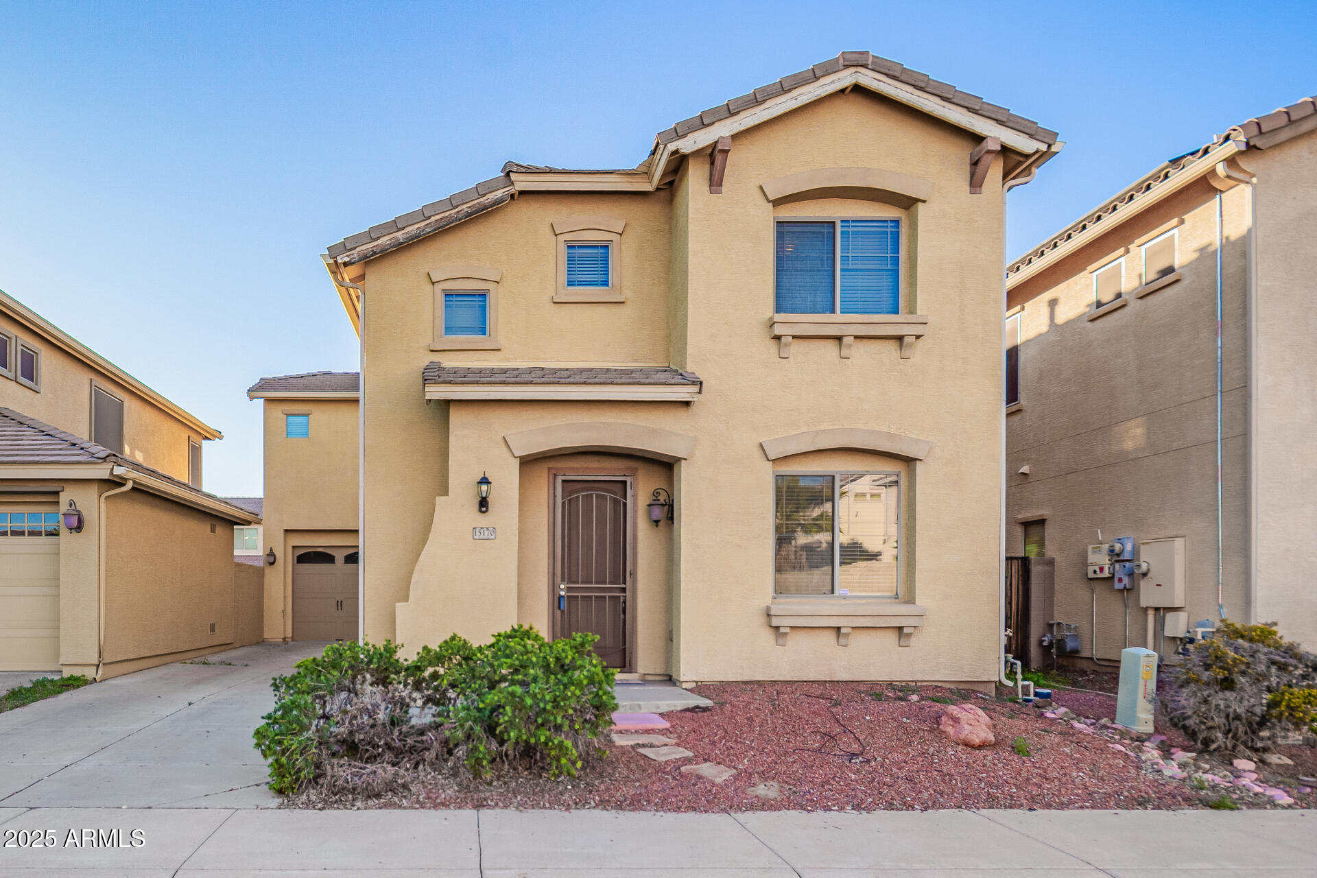 15170 North 145th Lane Surprise, AZ 85379 - Photo 2 of 40 a front view of a house with a yard