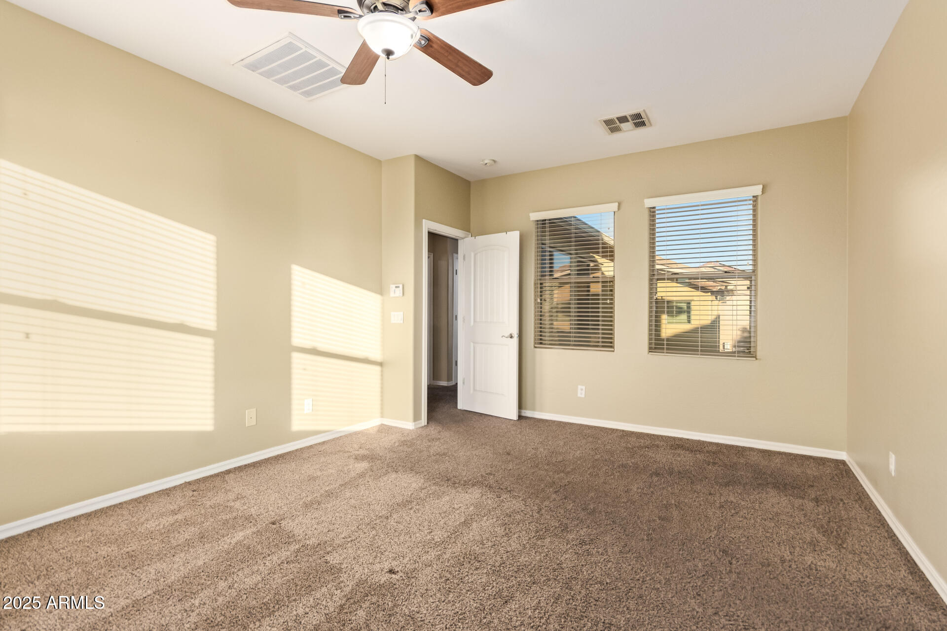 15170 North 145th Lane Surprise, AZ 85379 - Photo 22 of 40 a view of an empty room with a window