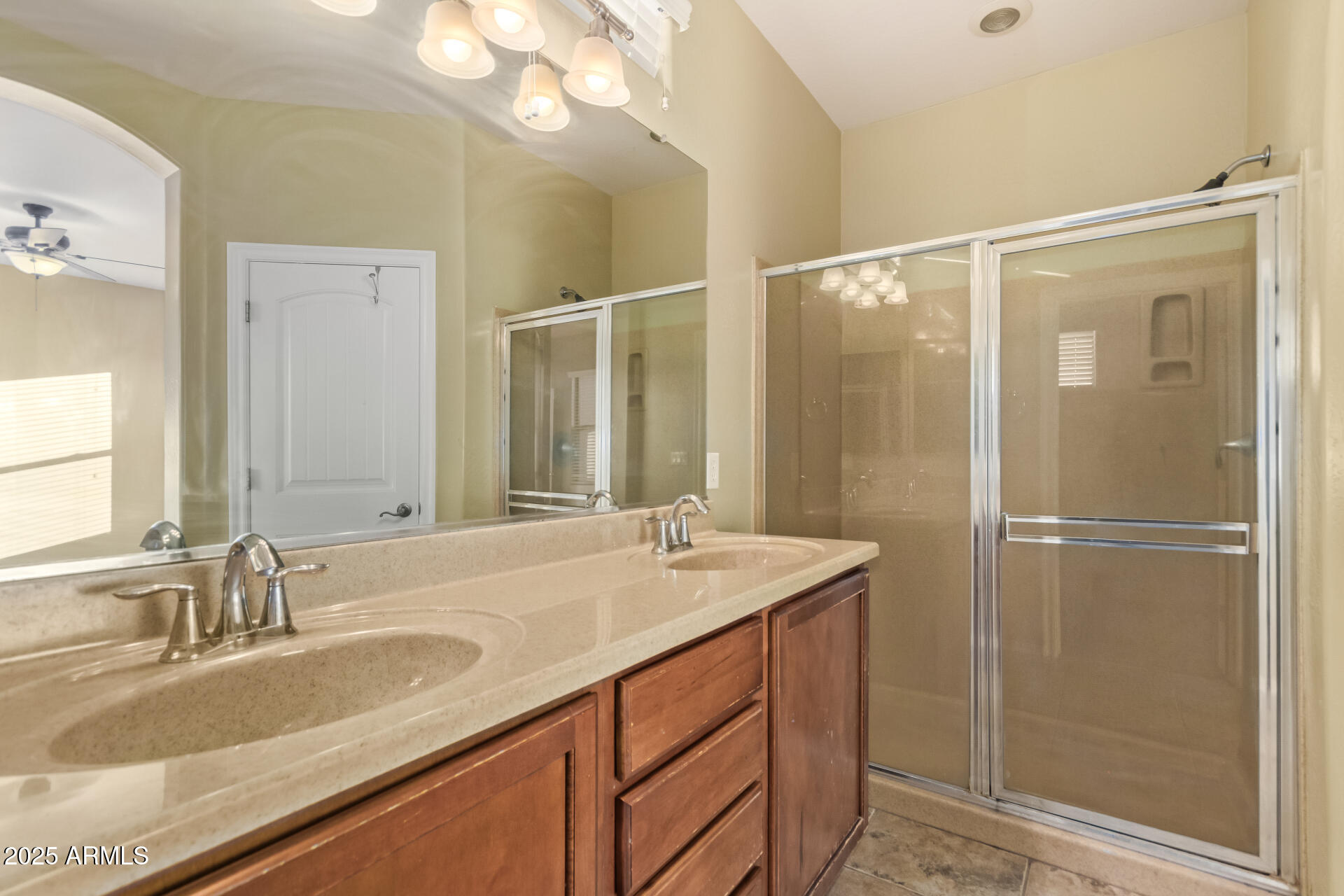 15170 North 145th Lane Surprise, AZ 85379 - Photo 25 of 40 a bathroom with a sink double vanity and a mirror