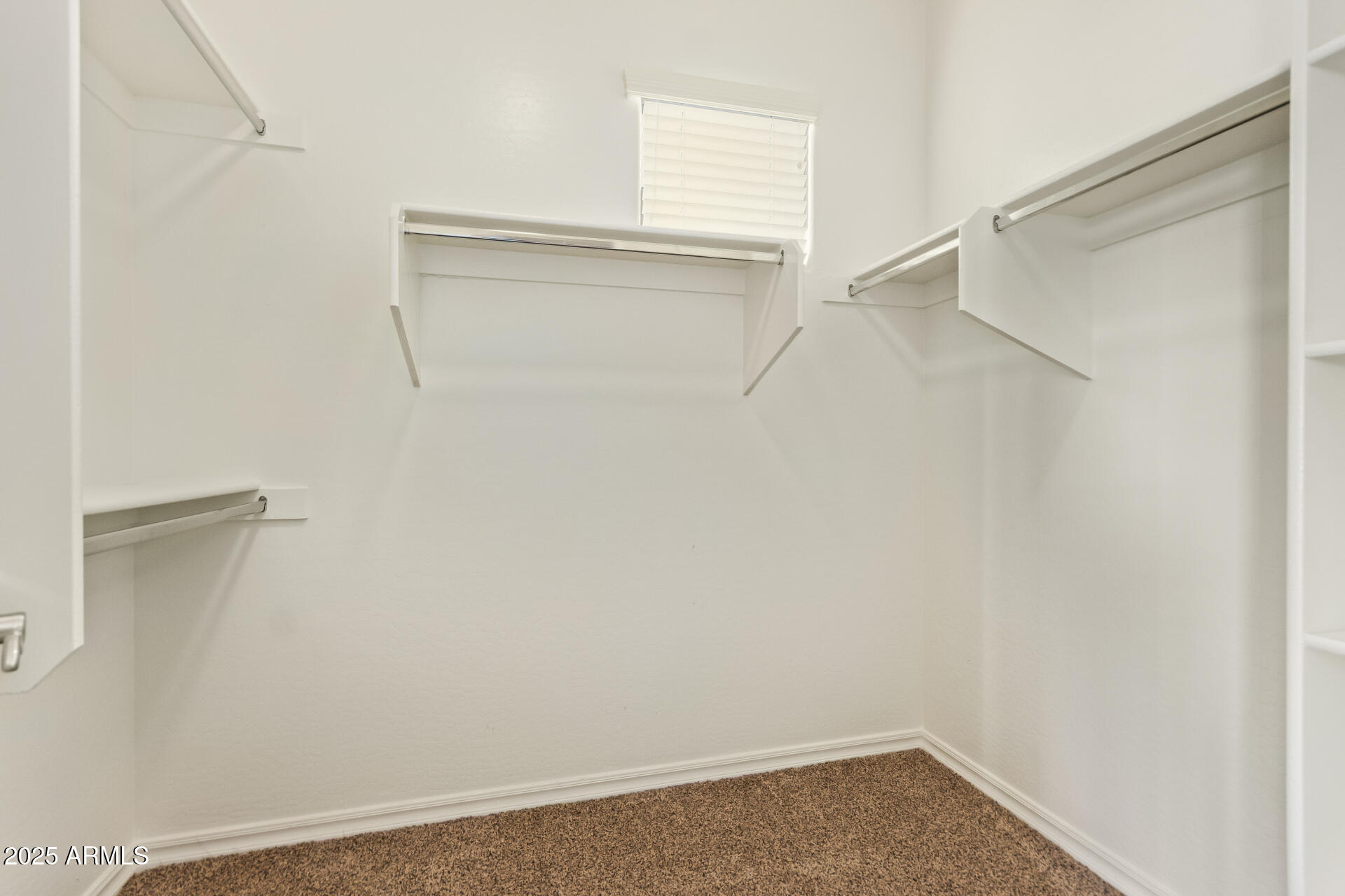 15170 North 145th Lane Surprise, AZ 85379 - Photo 26 of 40 a view of an empty walk in closet
