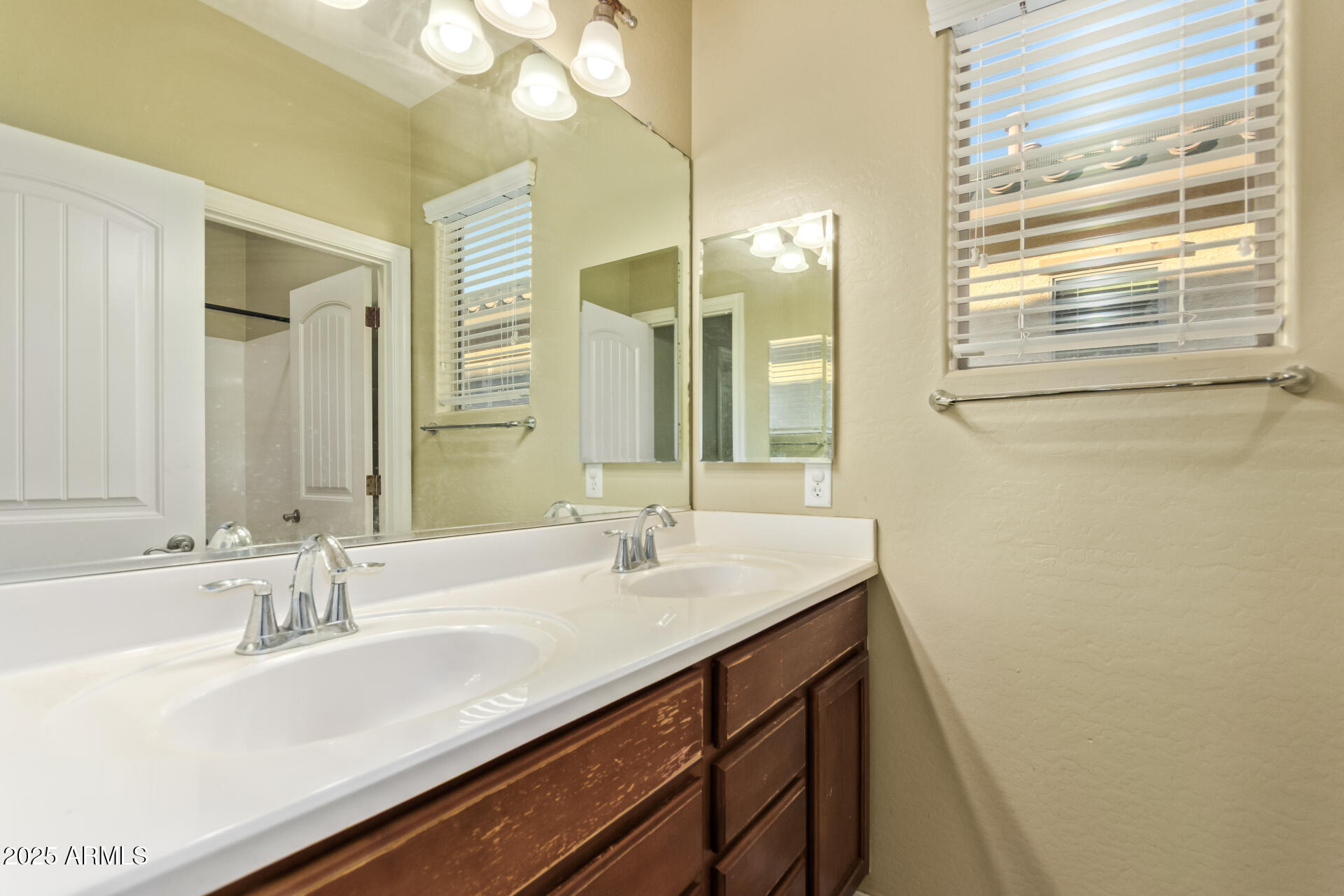 15170 North 145th Lane Surprise, AZ 85379 - Photo 34 of 40 a bathroom with a sink and a mirror