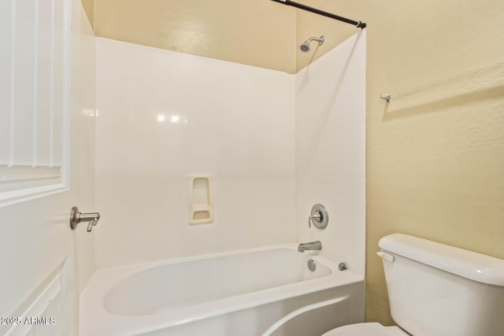 15170 North 145th Lane Surprise, AZ 85379 - Photo 35 of 40 a bathroom with a bathtub and a toilet