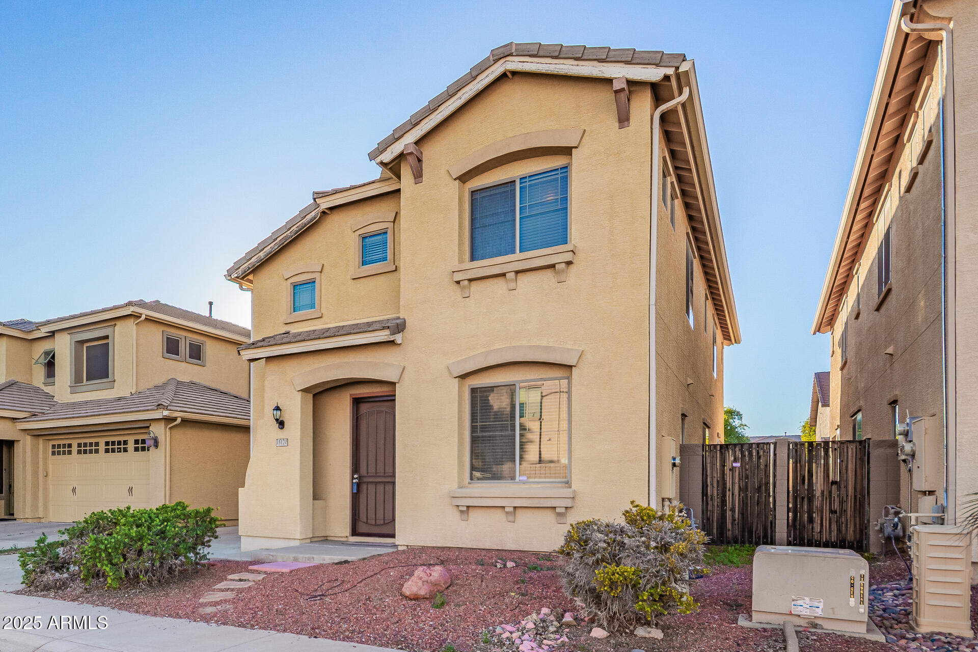 15170 North 145th Lane Surprise, AZ 85379 - Photo 6 of 40 a front view of a house with a yard