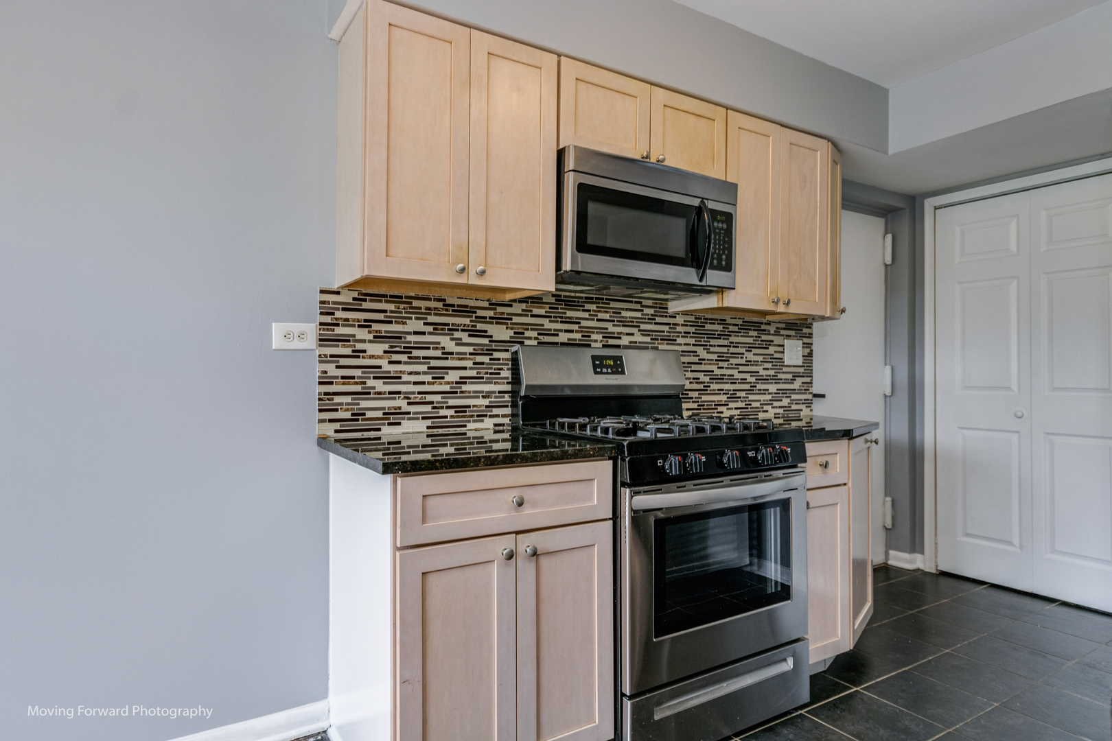 1234 Elder Court, Unit 1234 Wheeling, IL 60090 - Photo 11 of 24 a kitchen with stainless steel appliances granite countertop white cabinets and black stove top oven with dishwasher