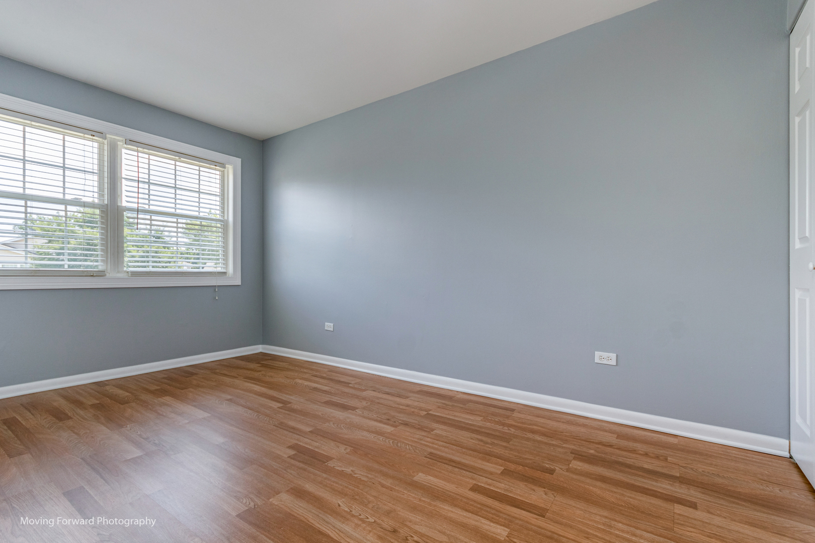 1234 Elder Court, Unit 1234 Wheeling, IL 60090 - Photo 13 of 24 a view of an empty room with wooden floor and a window