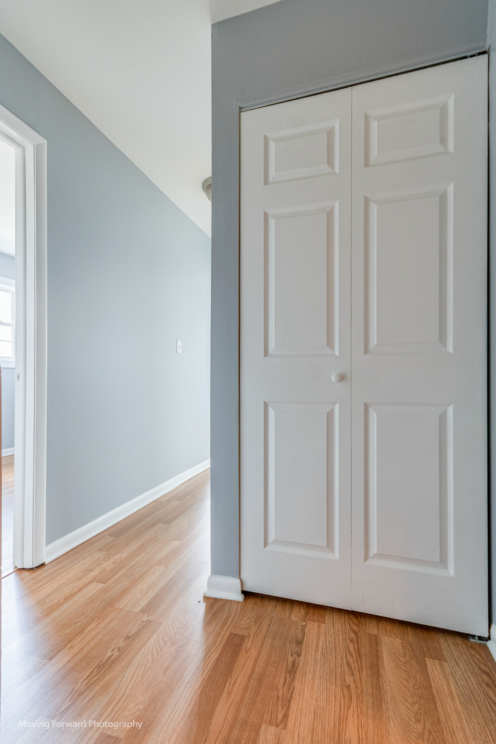 1234 Elder Court, Unit 1234 Wheeling, IL 60090 - Photo 20 of 24 a view of an empty room with wooden floor