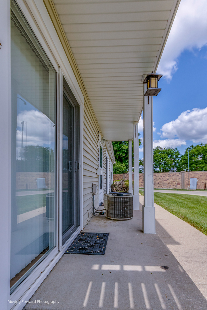 1234 Elder Court, Unit 1234 Wheeling, IL 60090 - Photo 22 of 24 a balcony view with a seating space