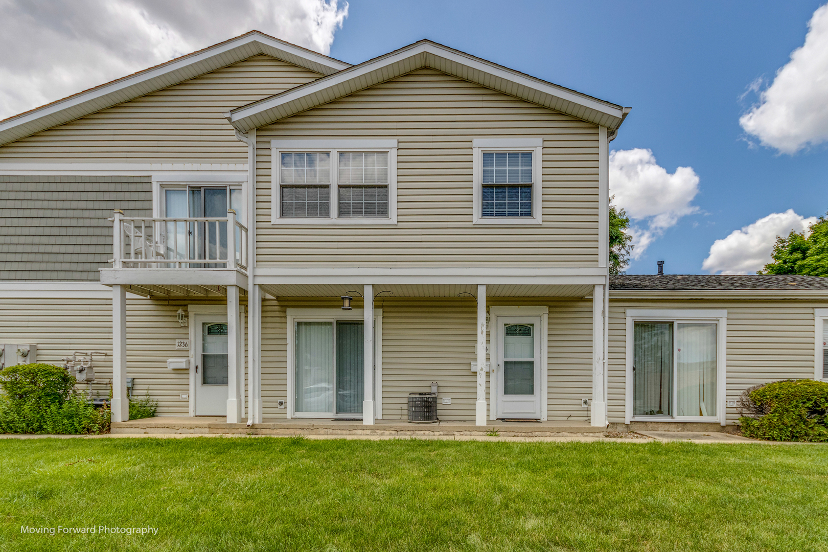 1234 Elder Court, Unit 1234 Wheeling, IL 60090 - Photo 23 of 24 a front view of a house with a yard