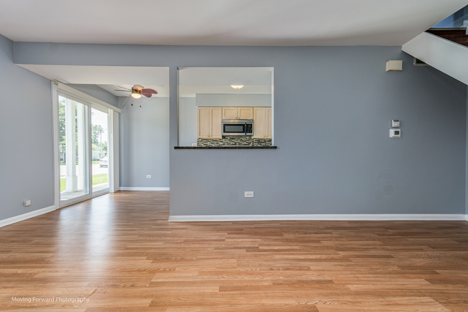 1234 Elder Court, Unit 1234 Wheeling, IL 60090 - Photo 6 of 24 a view of an empty room with window and wooden floor