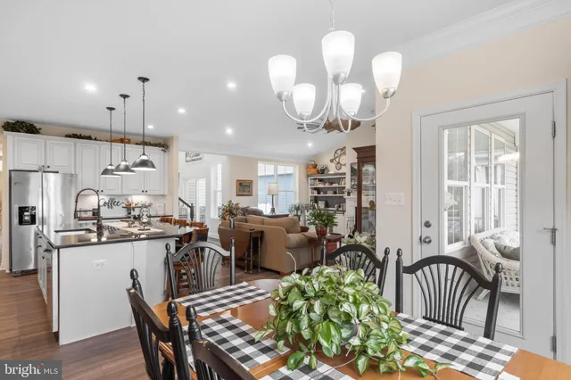 a spacious bedroom with a bed and a chandelier