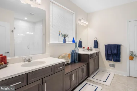 a bedroom with a bed and a dresser in it