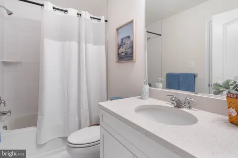 a front view of a house with a garden and porch