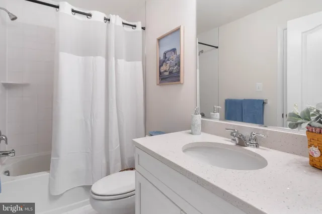 a front view of a house with a garden and porch