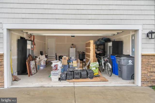a living room with furniture a table and large windows