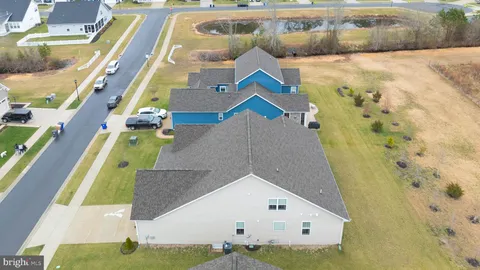 a view of a swimming pool with chairs