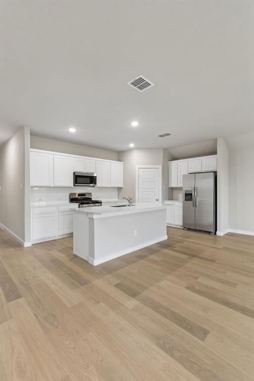 1124 Del Rio Drive Lavon, TX 75166 - Photo 9 of 32 Kitchen in the Emmy II home plan by Trophy Signature Homes - REPRESENTATIVE PHOTO