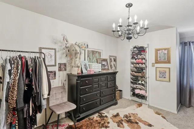 a view of a bedroom with furniture window and wooden floor