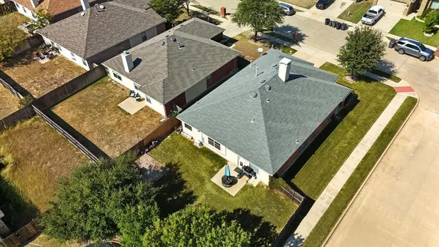 an aerial view of house with pool