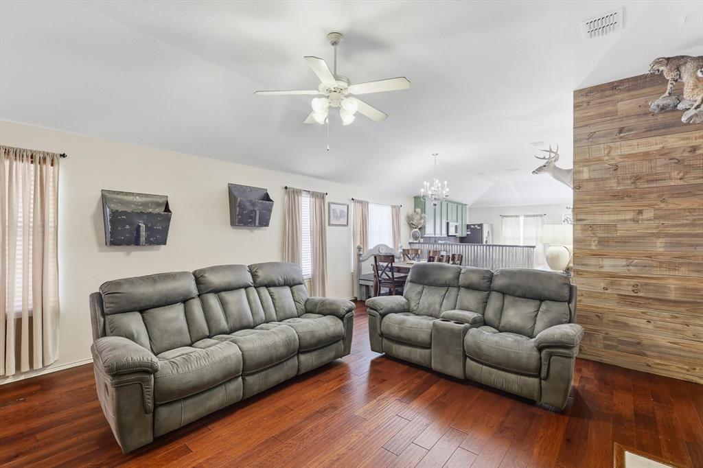 1201 Roping Reins Way Fort Worth, TX 76052 - Photo 9 of 34 a living room with furniture and wooden floor