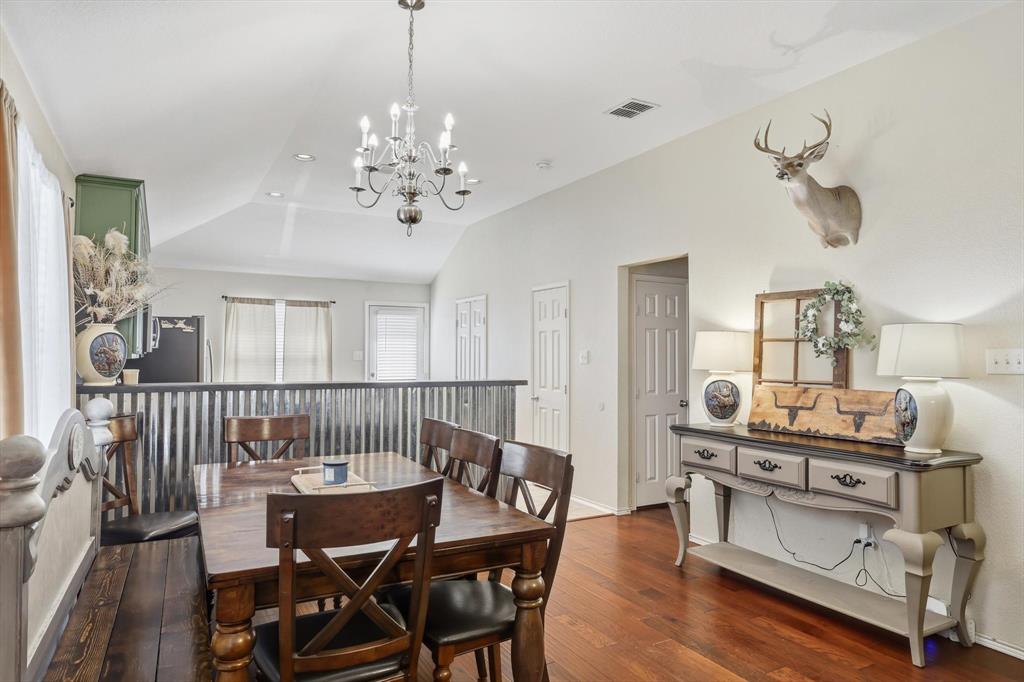 1201 Roping Reins Way Fort Worth, TX 76052 - Photo 10 of 34 a view of a dining room with furniture and wooden floor