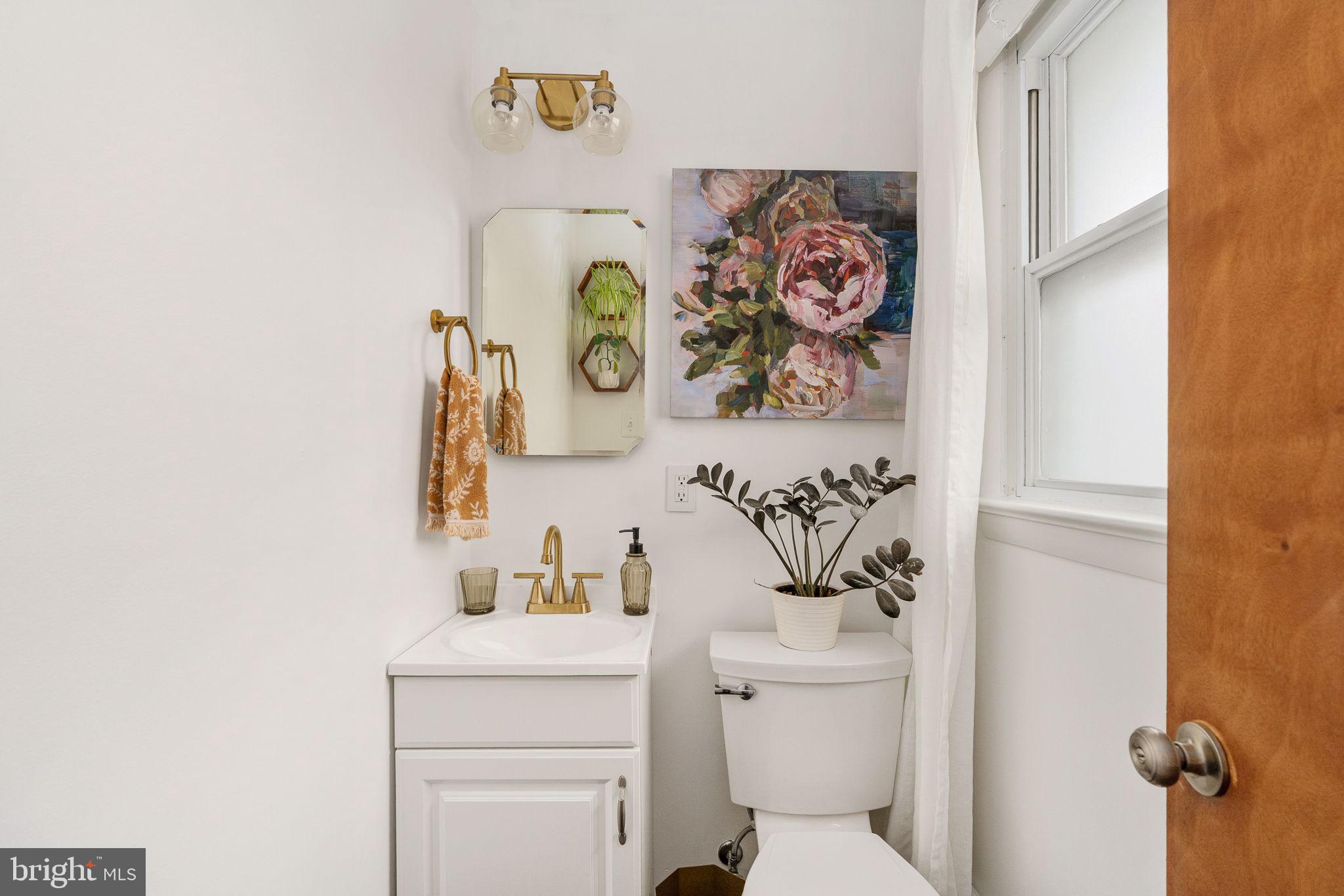 6714 Ruskin Street Springfield, VA 22150 - Photo 35 of 63 a bathroom with a toilet and a sink