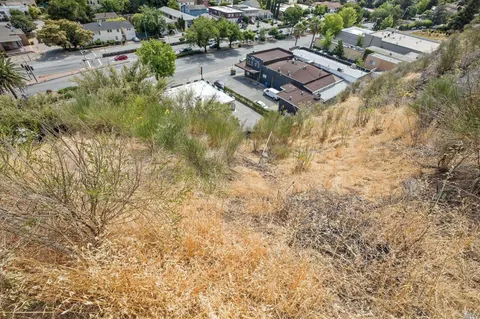 an aerial view of residential house with parking space