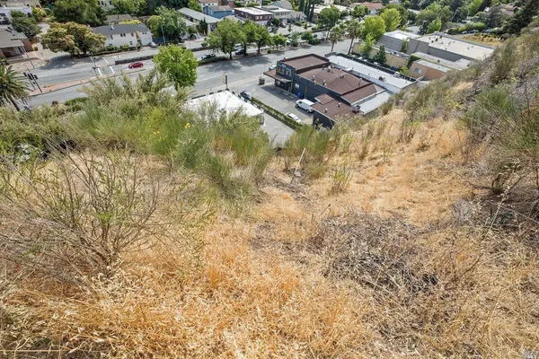 an aerial view of residential house with parking space