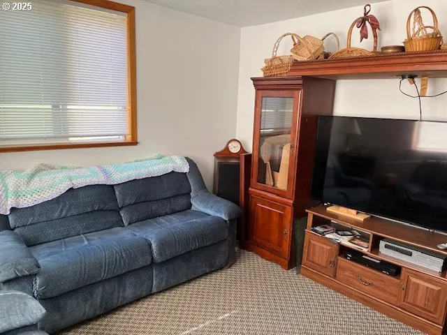 a dining room with furniture and a window