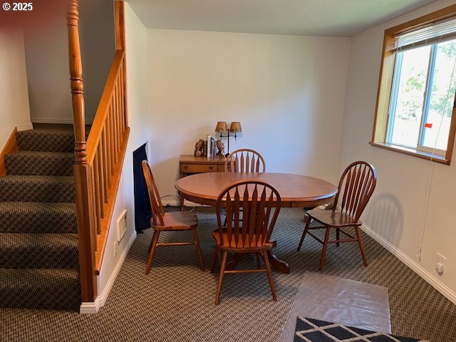78544 Rat Creek Road Cottage Grove, OR 97424 - Photo 19 of 44 a dining room with furniture and a window