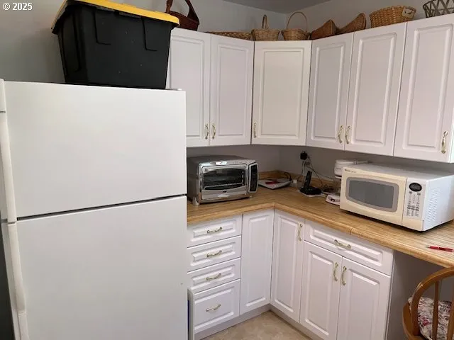 a bedroom with a bed and a table