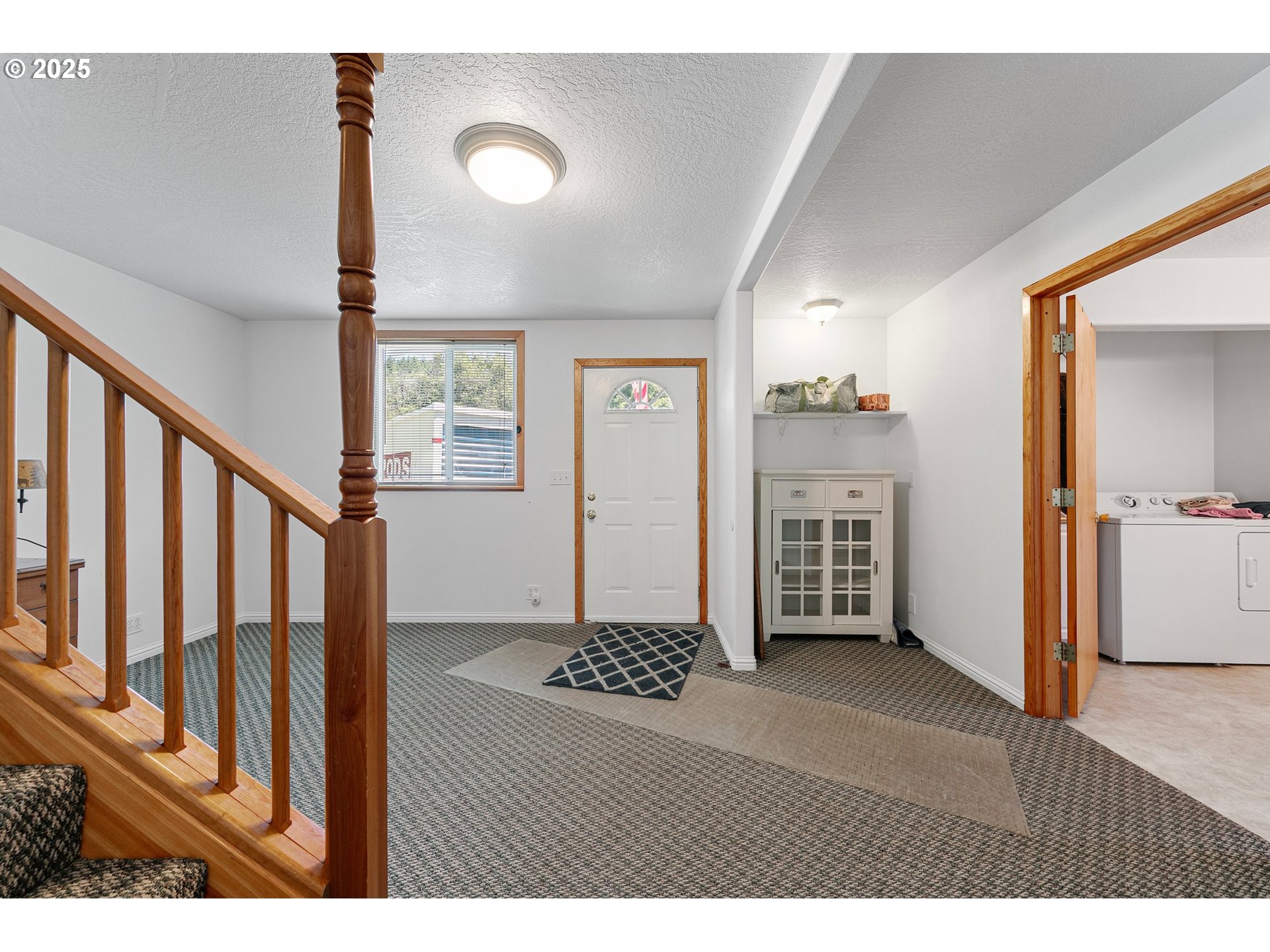 78544 Rat Creek Road Cottage Grove, OR 97424 - Photo 34 of 44 a view of an empty room with wooden floor and a window