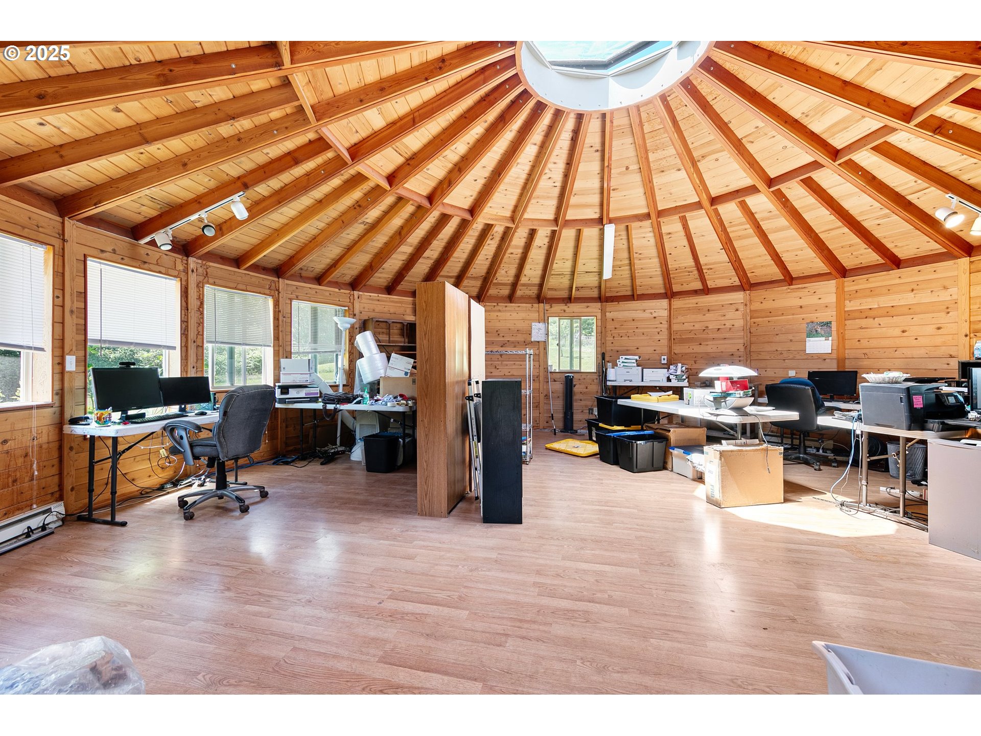 78544 Rat Creek Road Cottage Grove, OR 97424 - Photo 37 of 44 a living room filled with furniture and a wooden floor