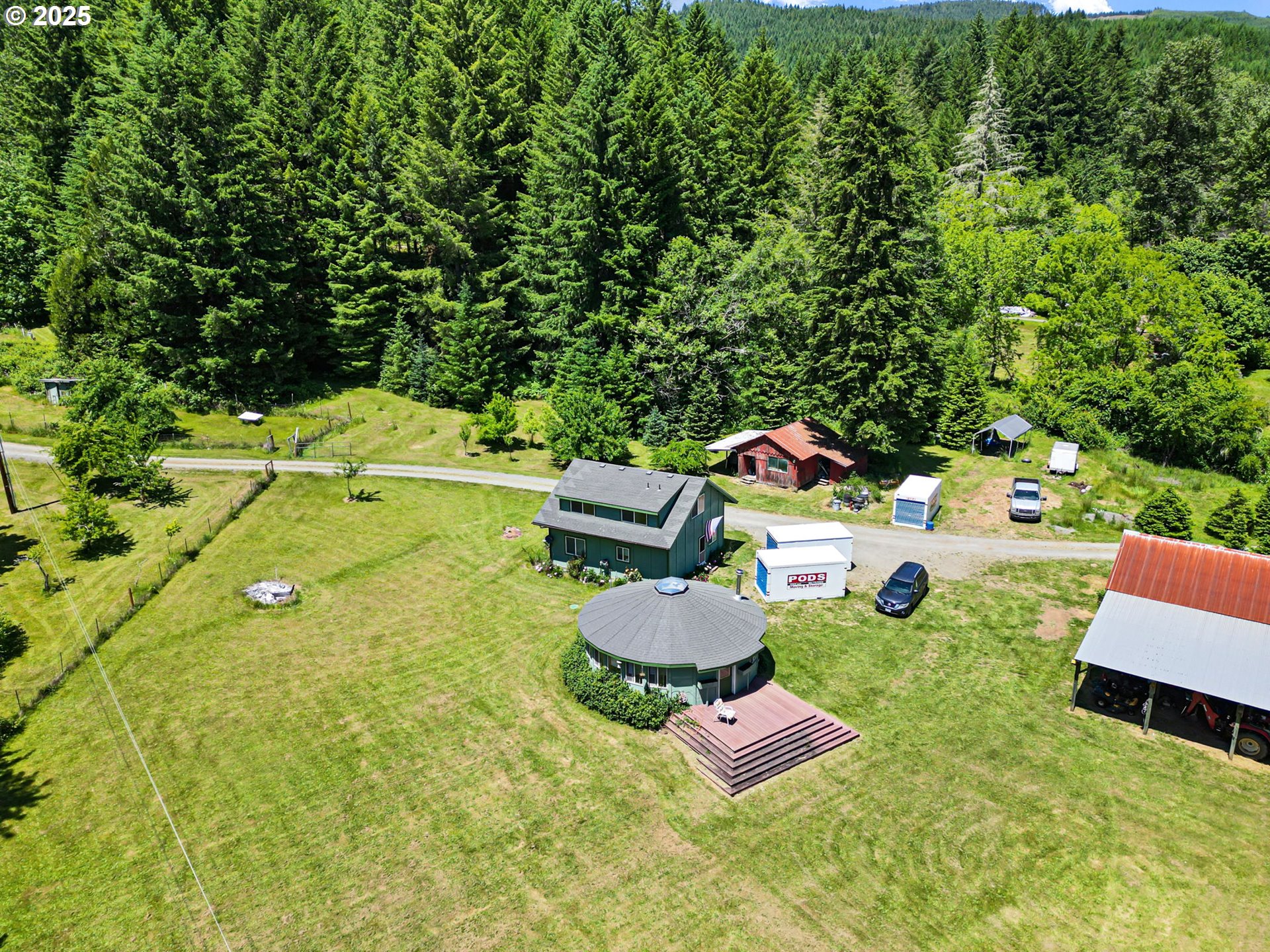78544 Rat Creek Road Cottage Grove, OR 97424 - Photo 40 of 44 an aerial view of a house with swimming pool and outdoor seating