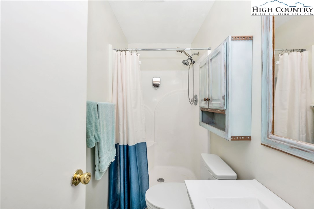 508 Curly Q Drive Crumpler, NC 28617 - Photo 26 of 39 a bathroom with a shower and a toilet