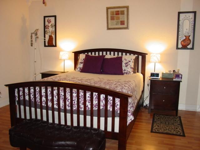 21338 Summertrace Circle Boca Raton, FL 33428 - Photo 11 of 22 a bedroom with a bed and wooden floor