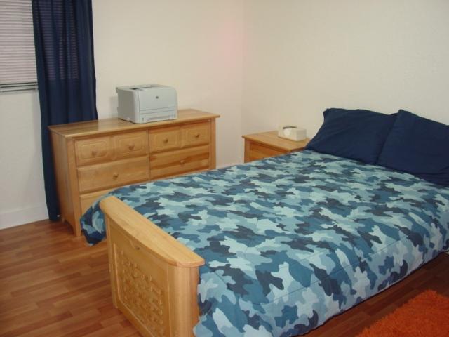 21338 Summertrace Circle Boca Raton, FL 33428 - Photo 20 of 22 a living room with a bed and dresser