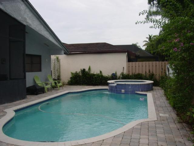 21338 Summertrace Circle Boca Raton, FL 33428 - Photo 22 of 22 a view of a swimming pool with a patio