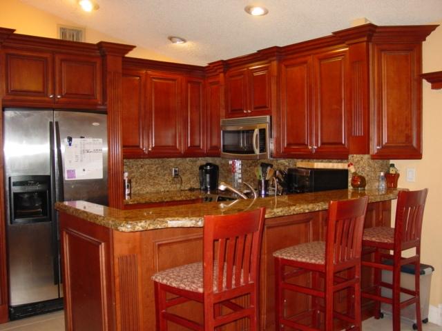 21338 Summertrace Circle Boca Raton, FL 33428 - Photo 3 of 22 a kitchen with stainless steel appliances granite countertop a stove top oven a refrigerator and cabinets