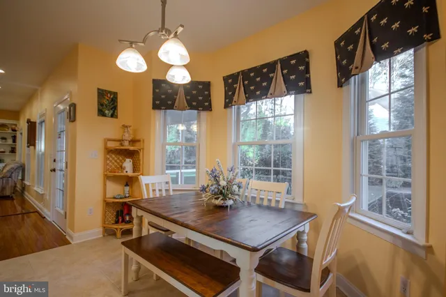 a living room with furniture and a lamp