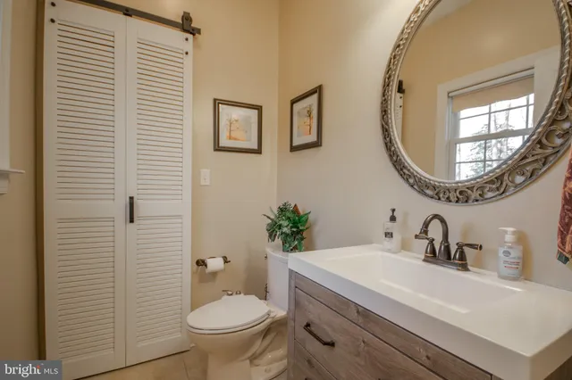 a bedroom with a large bed and a large window