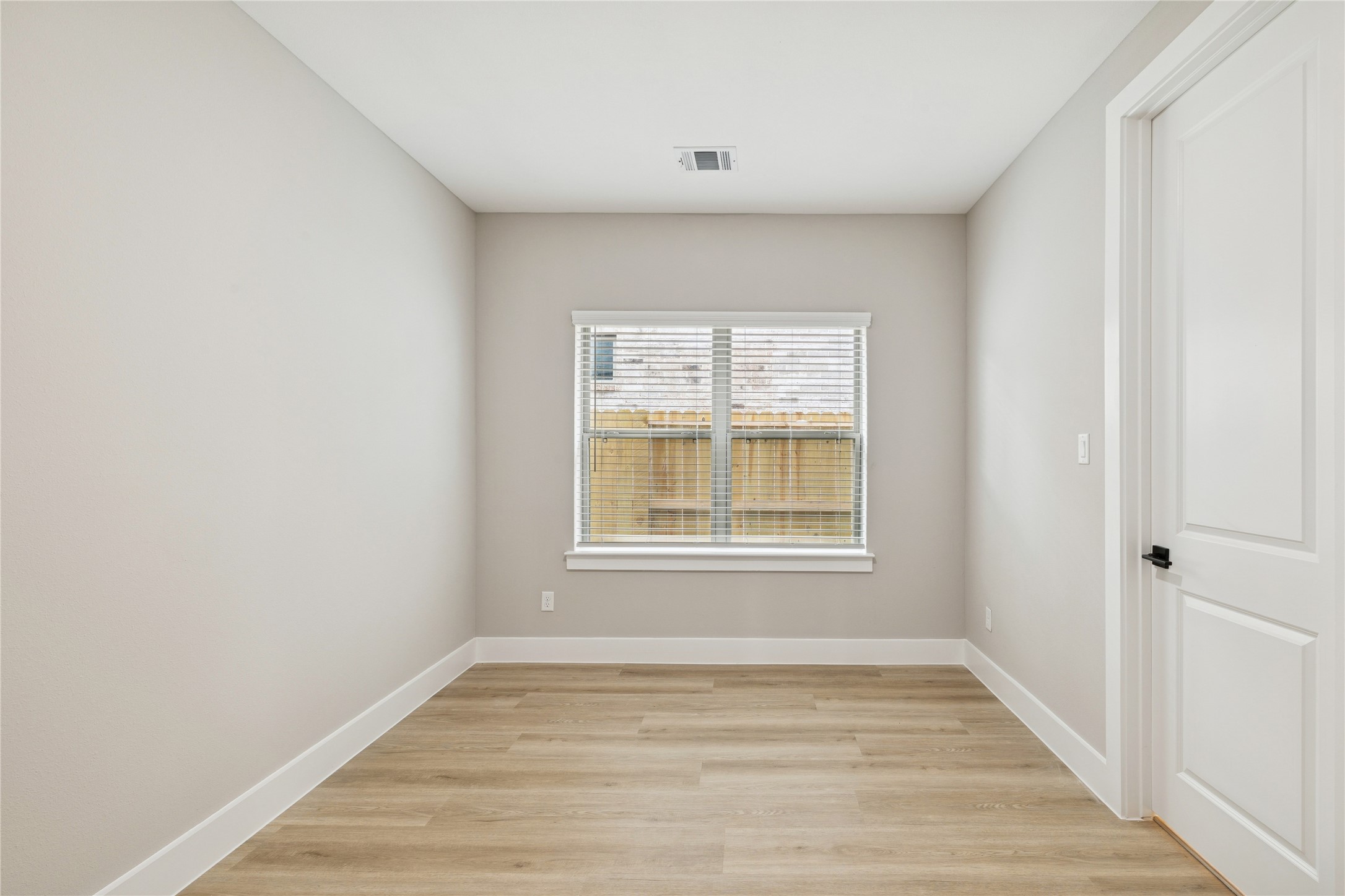 2602 Liguria Ln Spring Spring, TX 77388 - Photo 17 of 23 Cozy secondary bedroom with ample natural light and modern finishes, perfect for guests or a home office.